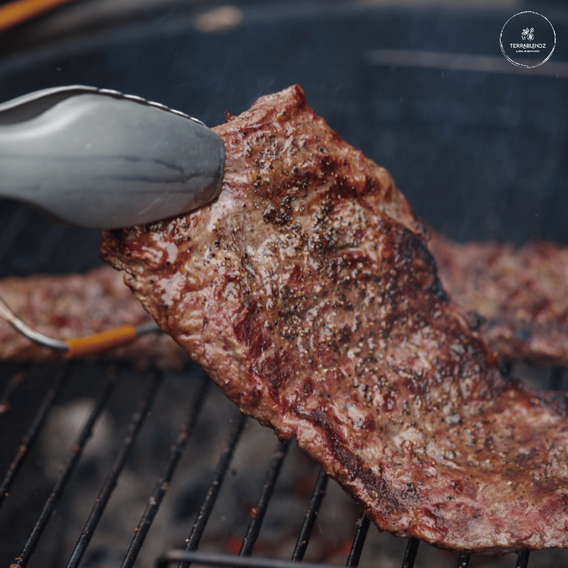 Cattle Run Steak Rub: Steak Cooking on BBQ.