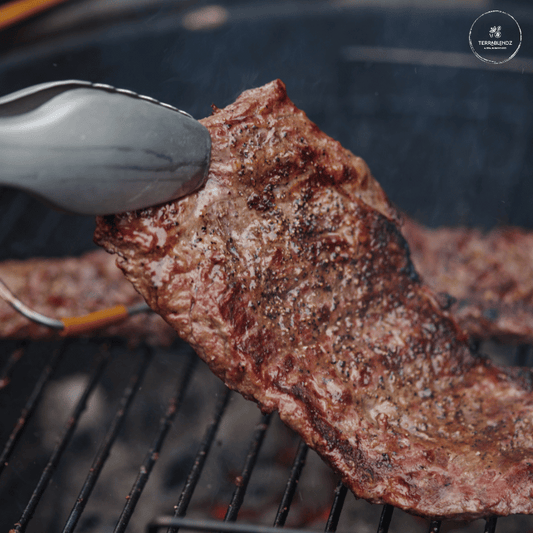 Cattle Run Steak Rub: Steak Cooking on BBQ.