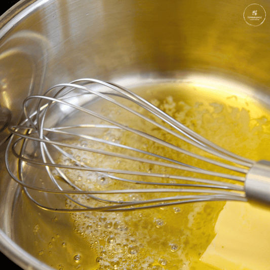 Melting butter in a bowl with a whisk