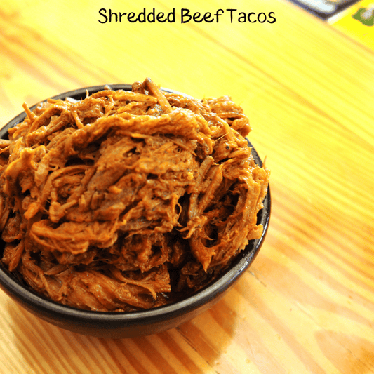 Shredded Beef in a bowl with the words Shredded Beef Tacos