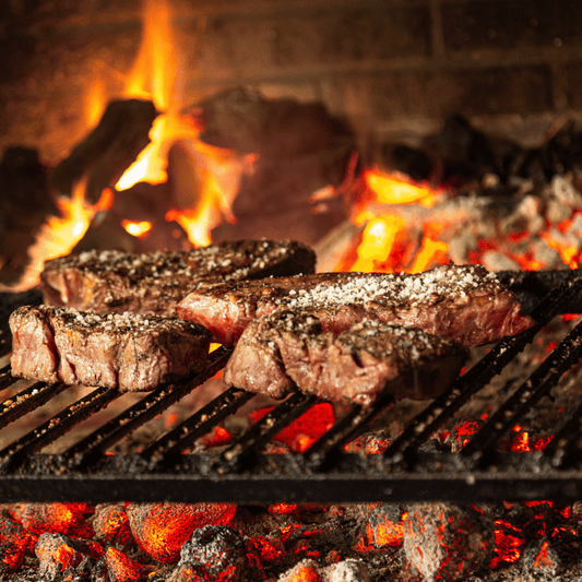 Terrablendz steak cooking on a grill with Bush Salt