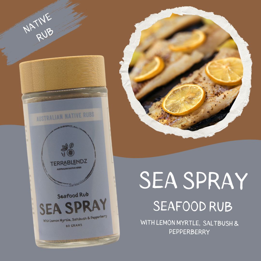 Sea spray seafood rub bottle with grilled fish and lemon slices on a brown background