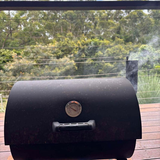 Smoker smoking meat with Australian native BBQ Rubs.